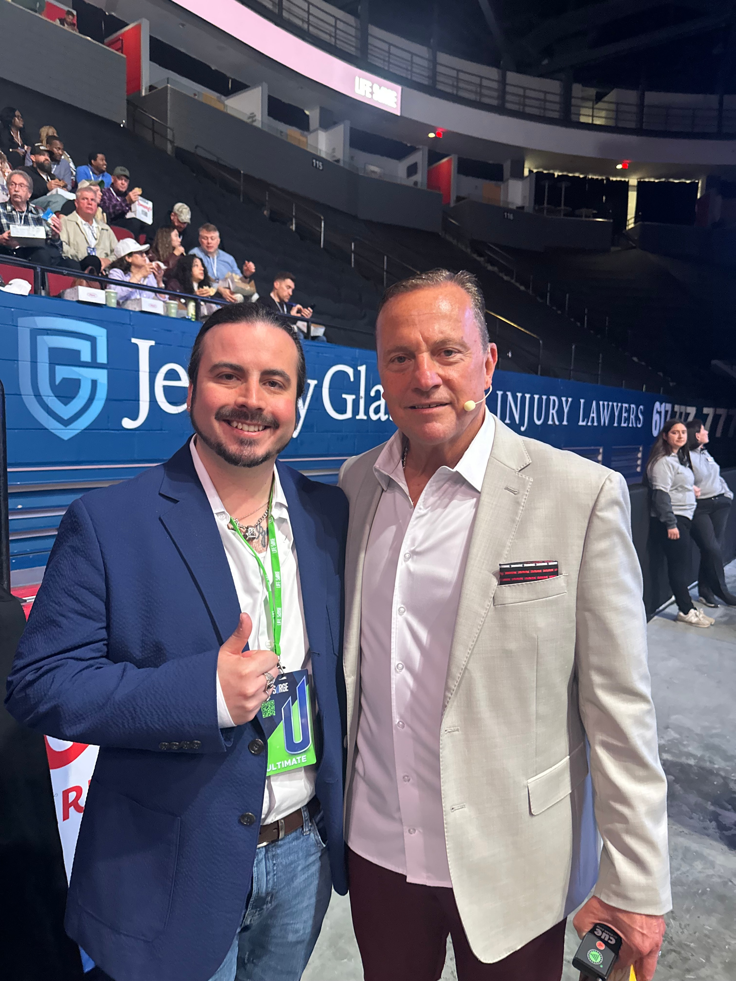 Gregory McCauley at a Life Surge event with Robert Herjavec