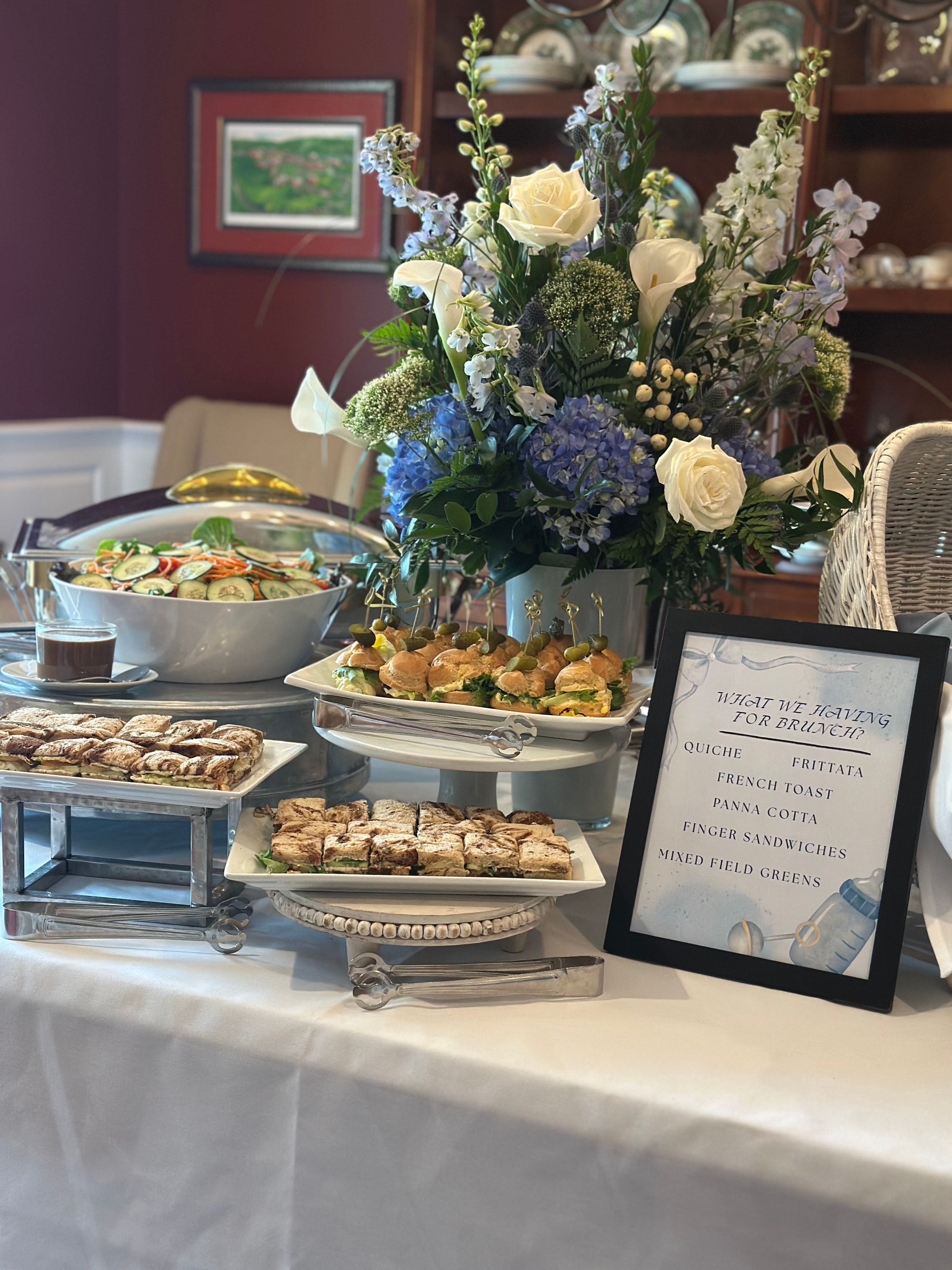 Easter dinner buffet spread with full table of seasonal dishes and elegant styling