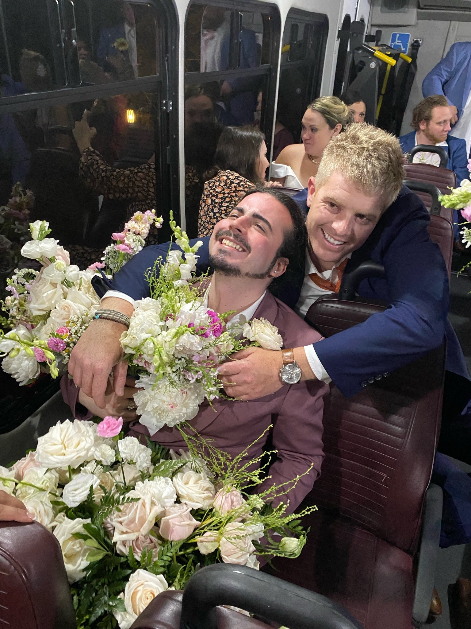 Gregory McCauley as flower boy on the wedding bus at The Flint's wedding